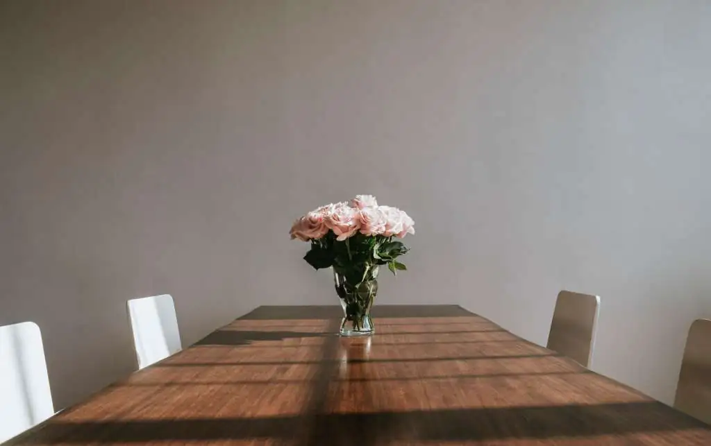 beautiful-pink-roses-vase-table_53876-153452