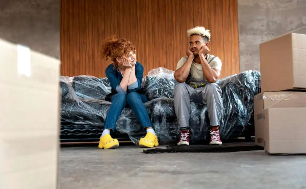 couple-with-cardboard-boxes-their-new-home_23-2149086868