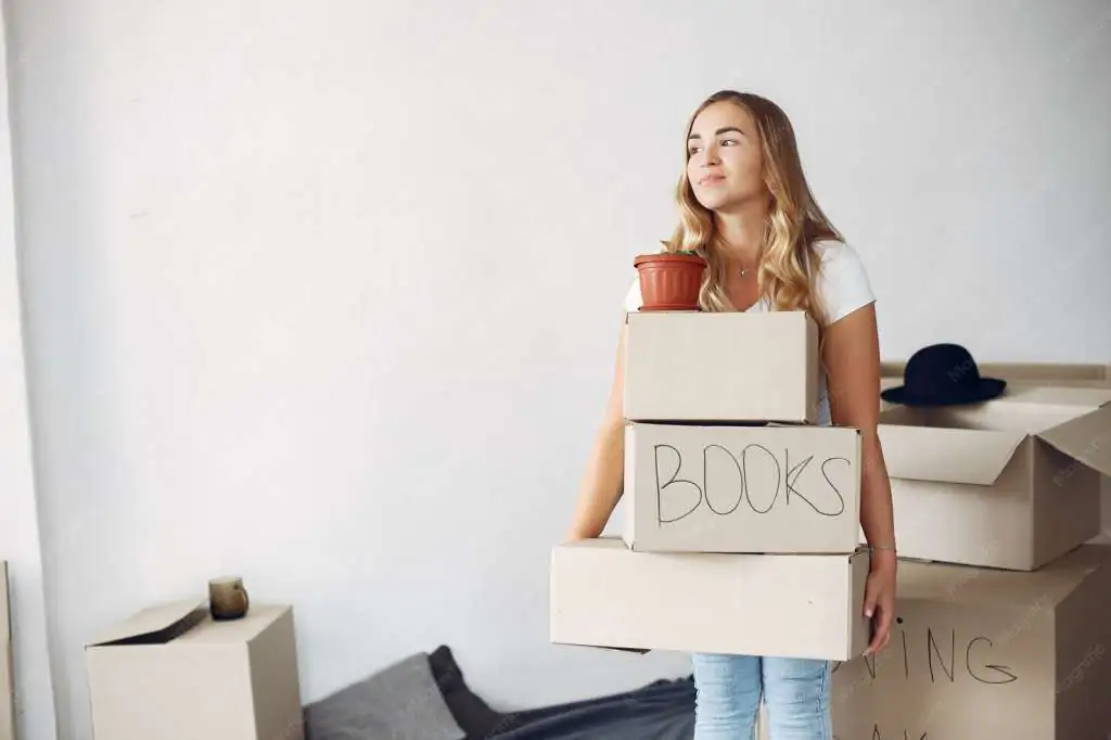 woman-moving-using-boxes_1157-35335