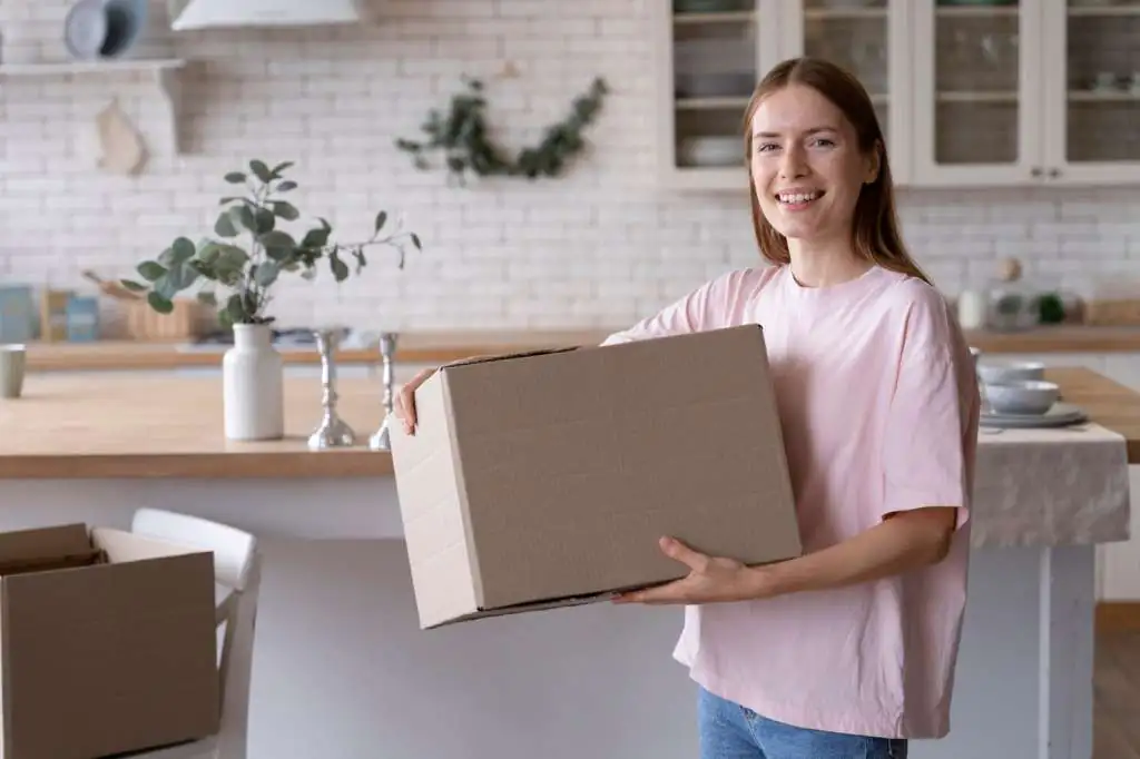 How to Pack a Kitchen for Moving: Step-by-Step Guide-2 close-up-person-making-home-comfortable_23-2149092075