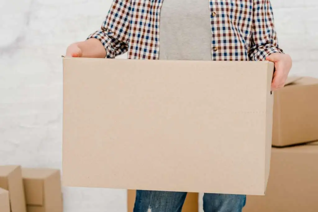 How to Pack Monitors for Moving-2 crop-woman-holding-box_23-2147758739