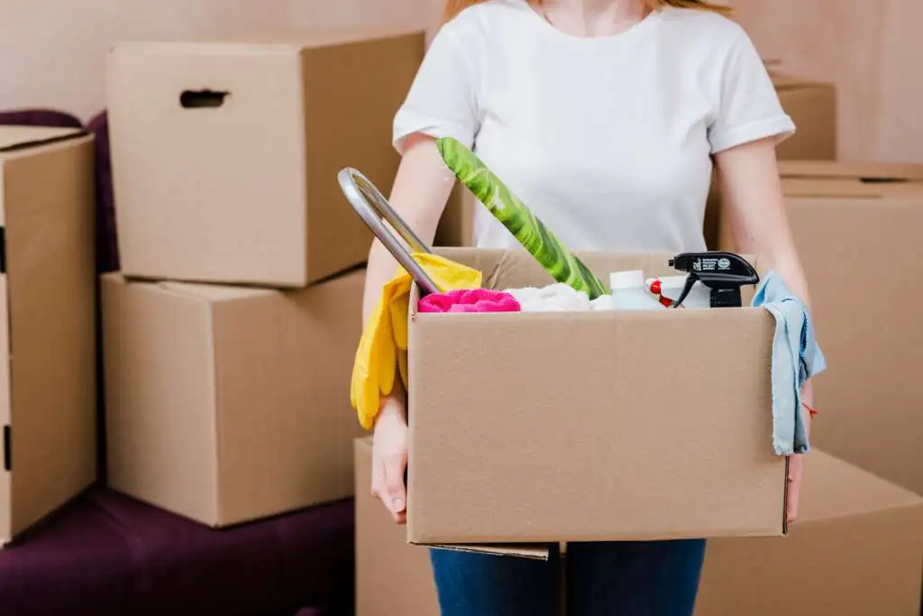 How to Pack Bathroom Items for Moving-2 crop-woman-with-box-with-things_23-2147758891
