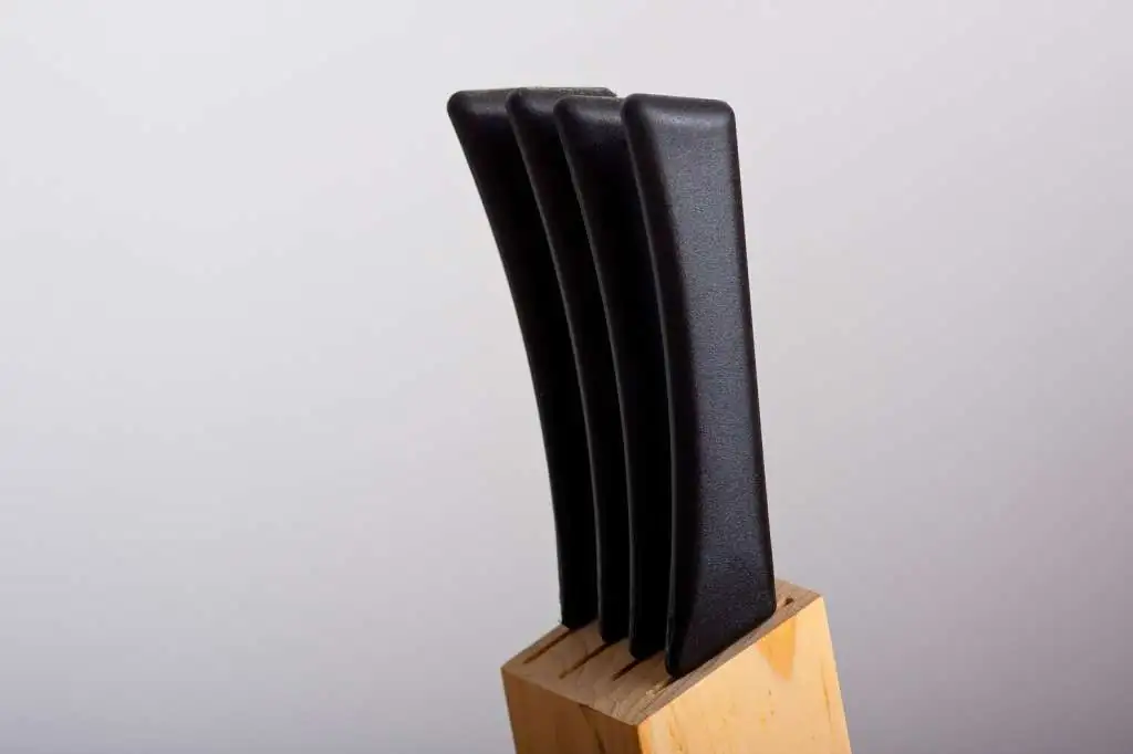 How to Pack Knives for Moving Safely-2 knives-with-black-handles-put-knife-stand_181624-12382