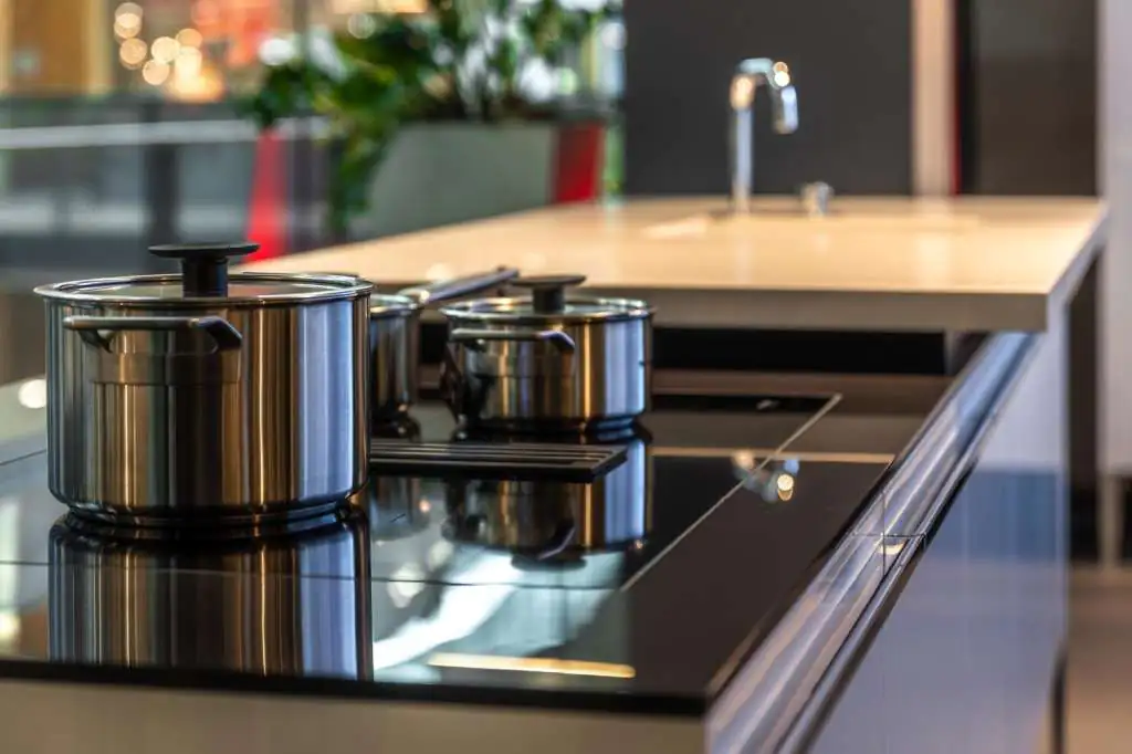 How to Pack Pots for Moving: Step-by-Step-2 modern-induction-cooktop-with-stainless-steel-pots-stylish-meal-preparation-area_169016-72495