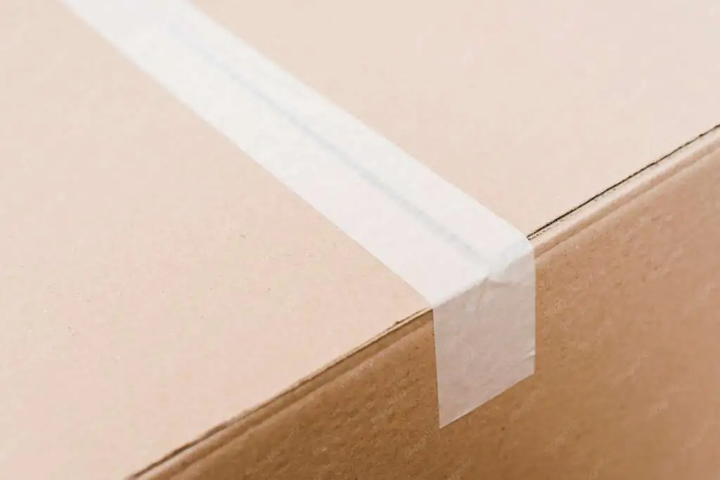 How to Pack Pillows and Blankets for Moving-3 overhead-view-cardboard-box-sealed-with-white-packing-tape_23-2148095546