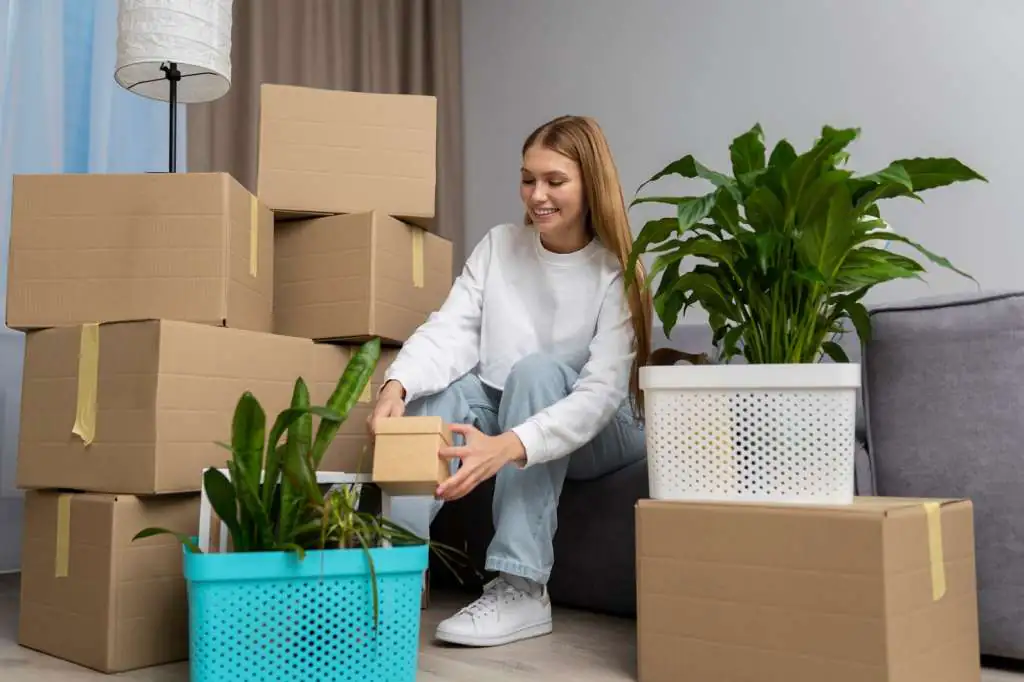 How to Pack Plants for Moving: Step-by-Step-3 woman-handling-belongings-after-moving-new-house_23-2149312732