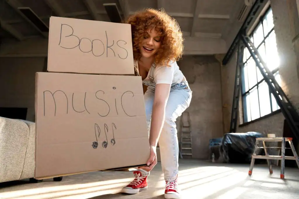 How to Pack Records for Moving-2 woman-handling-belongings-cardboard-boxes-moving-new-house_23-2149086799