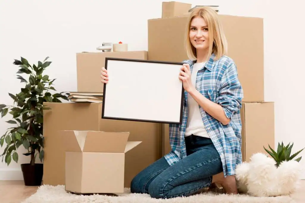 How to Pack Paintings for Moving: The Complete Guide-3 woman-moving-new-house_23-2148569389