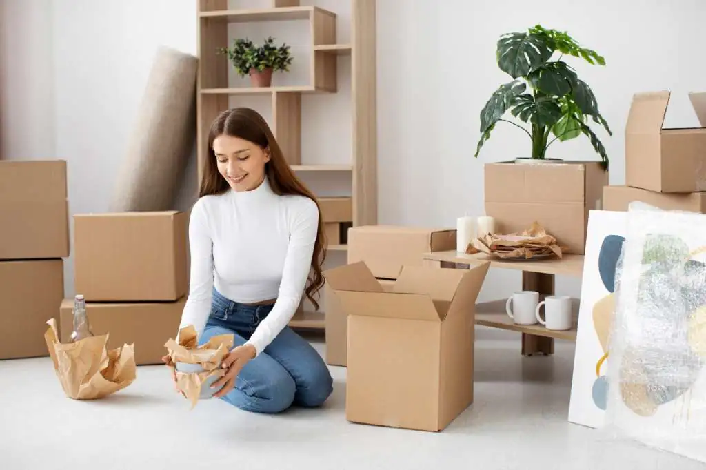 How to Pack a Kitchen for Moving: Step-by-Step Guide-3 young-adult-moving-new-house_23-2149275864