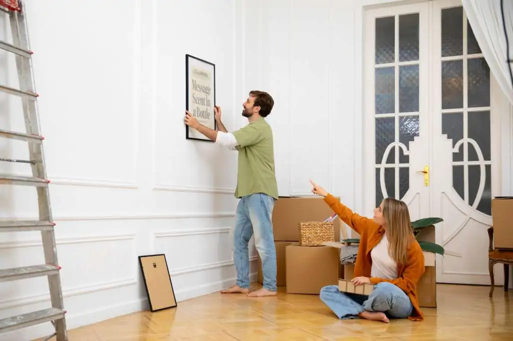 How to Pack Artwork for Moving: Step-by-Step Guide-3 young-couple-moving-new-home_23-2149242085